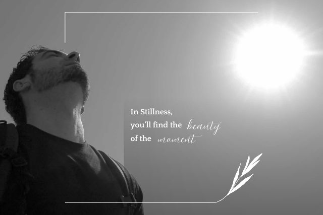 A man looking out toward the sun, thinking