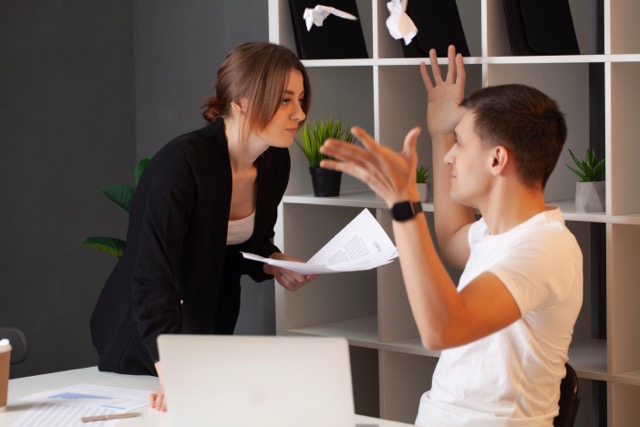 An angry customer in conflict with a manager