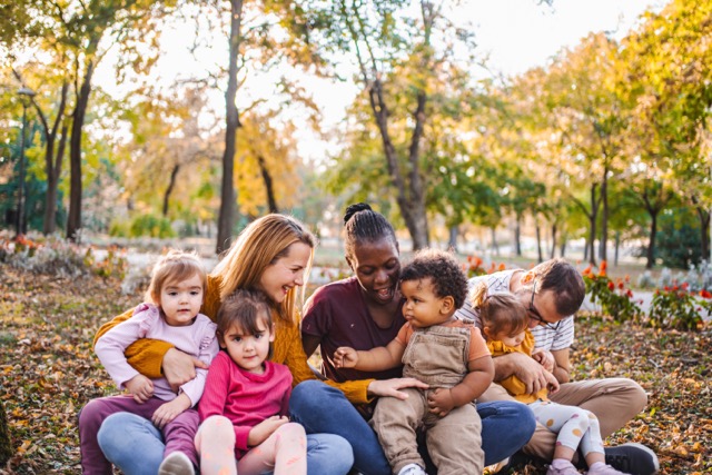 A family embracing outdoors in autumn