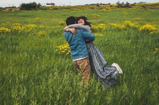 Relationship improvement plan: a couple together in a field