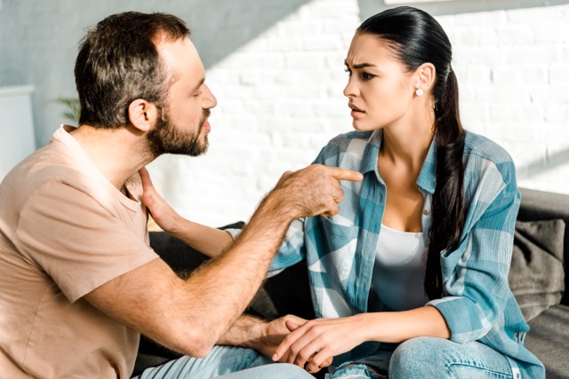 A couple having an argument, one dismissing the other