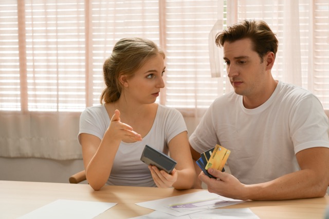 A married couple thinking through a financial problem