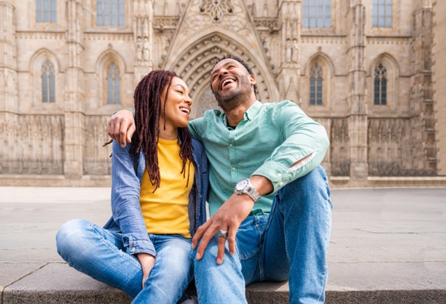 A happy Hispanic couple on a date outdoors, showing the joy possible in cross cultural relationships