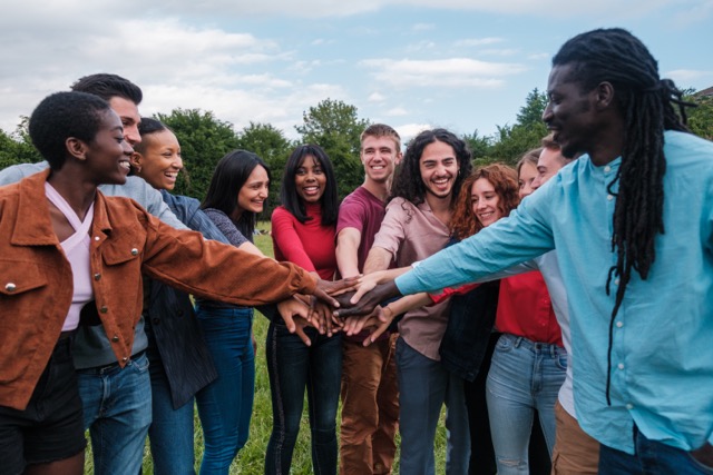 A multicultural group of friends outdoors