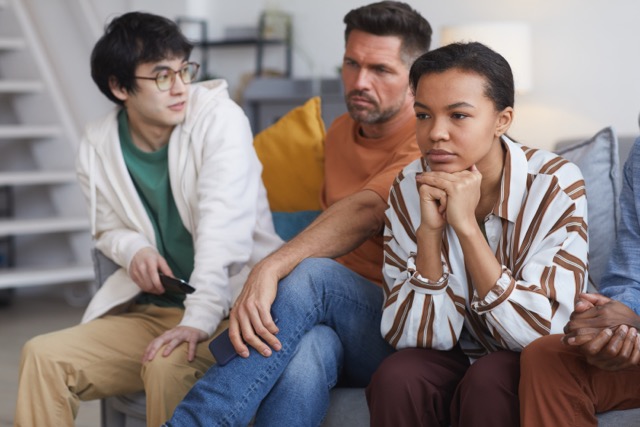 People watching television at home