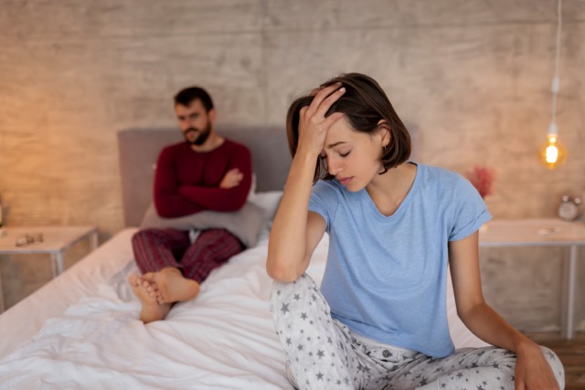 A young couple arguing in the bedroom
