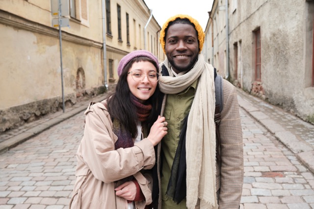 A smiling interracial couple, representing cultural diversity in marriage