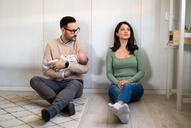 A tired new mother at home