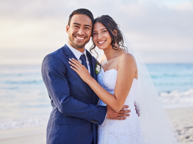 Save Marriage: Its our big day today. Shot of a young couple on the beach on their wedding day