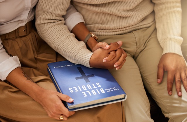 Love, bible and couple holding hands, studying and support with religious practice, teaching and gr.