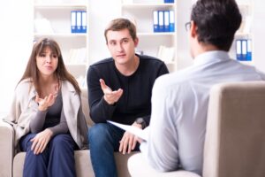 Couple Counseling- two couple in counseling center 