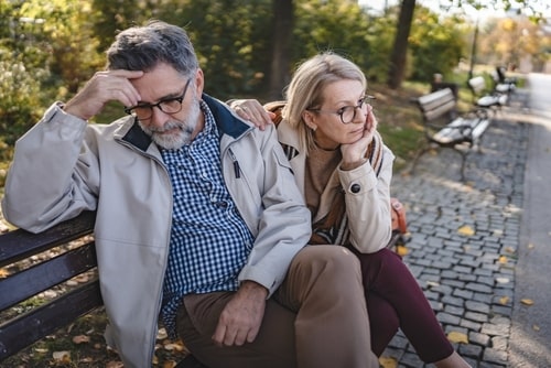 Christian Couples Therapy: two unhappy christian couple sitting on a bench 