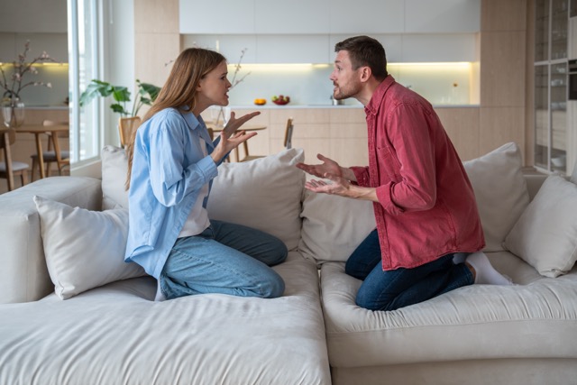 Passive aggression in marriage: Angry emotional couple shouting, screaming, blaming each other. Scandal between annoyed irritated wife and defensive husband. Marital discord, toxic relations, conflicts, gaslighting in family life