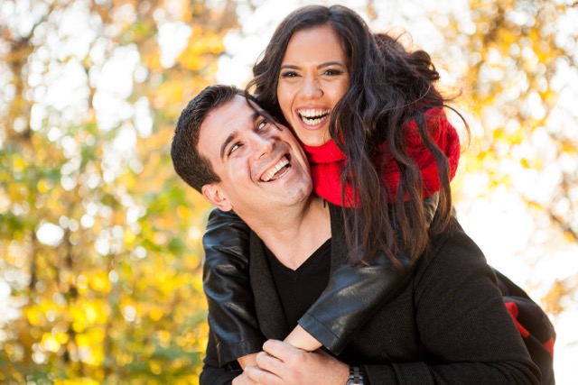 Codependent Relationships: Amazing funny young couple in autumn park having fun