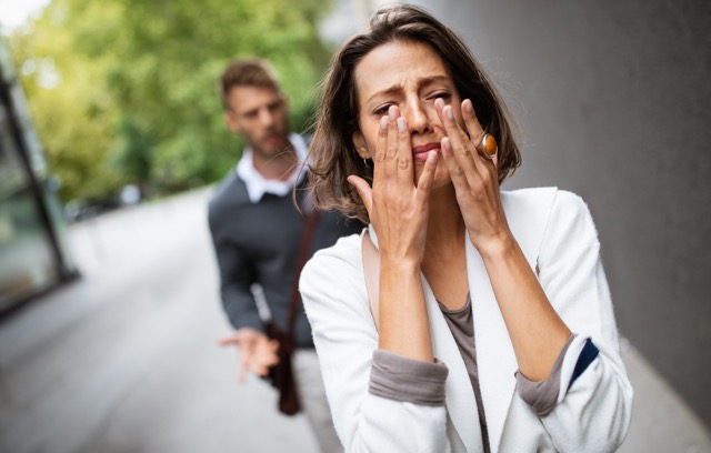 Breakup of a couple with man and sad girlfriend outdoor. Divorce, couple, love, pain concept.