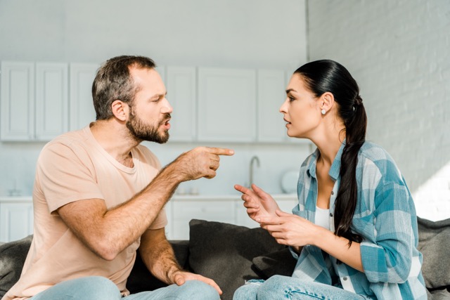 Constant Arguing: couple having argument and husband yelling at wife at home