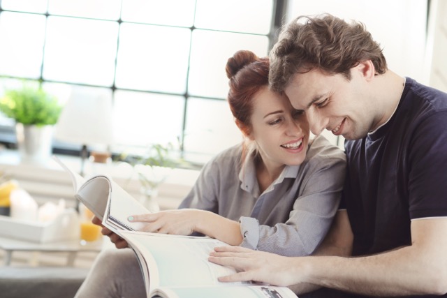 Relationship. Lovely couple at home and husband helping wife with professional help. 