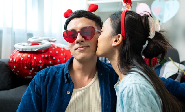 A young couple with kiss Day activities at home