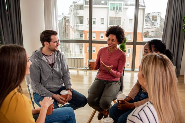 people sitting in circles in a group therapy session.