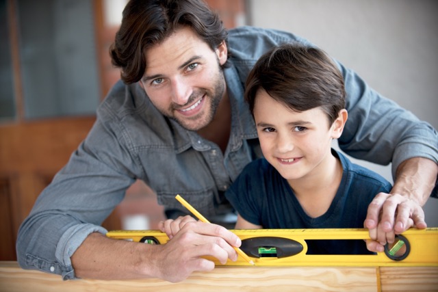 A father and son doing woodwork together