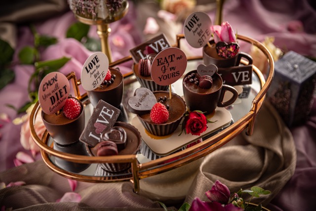 Ways to Celebrate Chocolate Day: Still life of luxury mousse in little chocolate bowls and cups for Valentines day