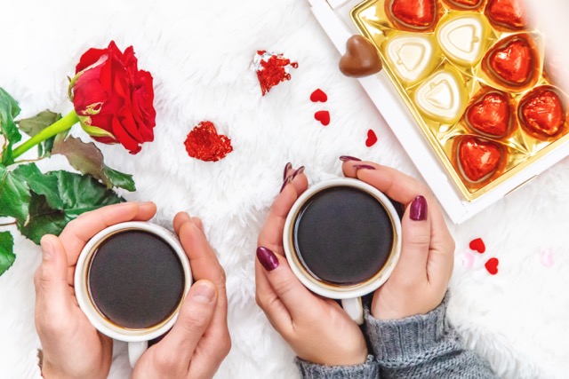 Lovers drink coffee with sweets. Selective focus. Drink